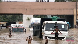 Thousands flee homes in India’s capital as torrential rains cause river to overflow