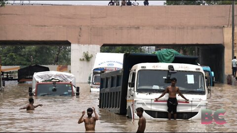 Thousands flee homes in India’s capital as torrential rains cause river to overflow