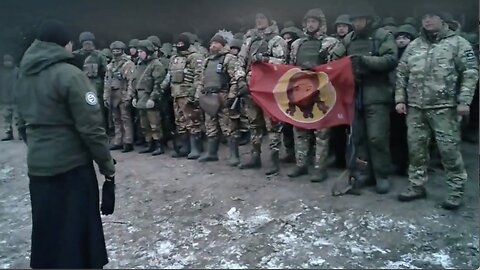 Russian soldiers pray before going on a combat mission against Black Rock financed cannon fodder