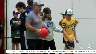 Outlook Nebraska plays the inclusive game 'Beep kickball' with the visually impaired