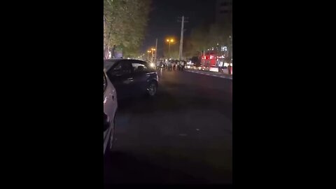 Fearless Young ⁦‪#Iranian‬⁩ protesters in the city of Amol kneel in front of violent riot police.