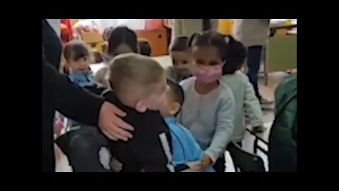 Beautiful moment little Ukrainian boy is hugged by his new classmates bringing a huge smile to his