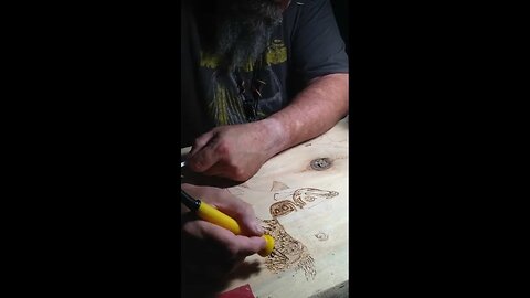 Wood burning a Grizz and King Salmon on my bar top. 🍺