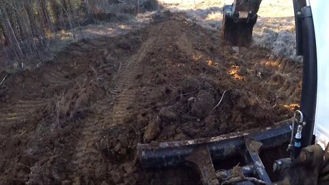 Excavator Extended clips building a new road project, clearing trees