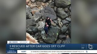 3 rescued after car goes off cliff