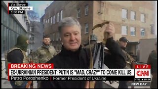 Fmr. Ukrainian President Takes Up Arms Alongside Civilian Defense Forces