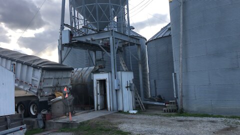 Faith, Family, Farm. Lighted Cross on Grain Leg