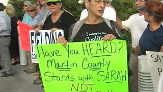 Rally in support of commissioners charged