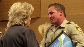 Las Vegas police officer honored for saving man who pointed a gun at him