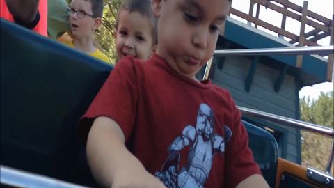 Little Boy’s First Amusement Park Ride