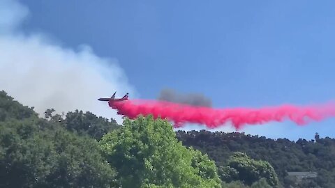 Plane attempts to put out Avila Fire near Pismo Beach, CA