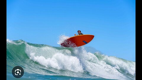 "Riding the Fury: Surfers Tame the Mighty Waves!"