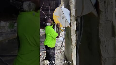 Trimming some columns in a construction site in Hialeah.