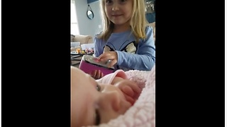 Toddler preciously makes her baby sister laugh