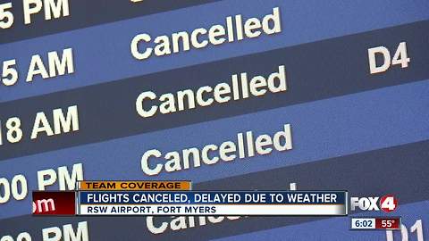 Travelers scramble as snow storm cancels flights