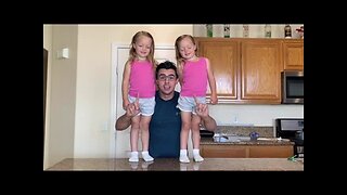 Renato Fernandes exercises with daughters