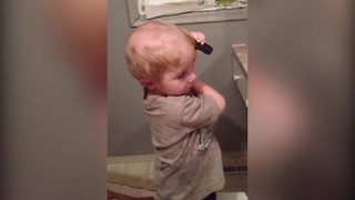 Young Boy Gives Himself A Haircut