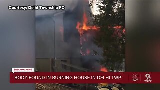 Body found inside burning home in Delhi Township