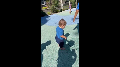 kid playing with water