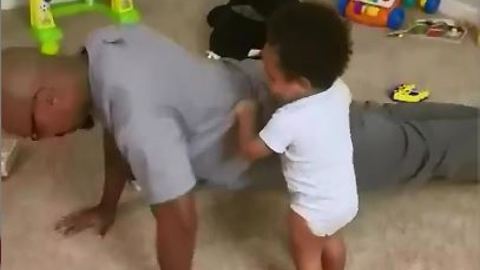 Baby Fitness Coach Makes Sure Dad Does His Push-Ups Right