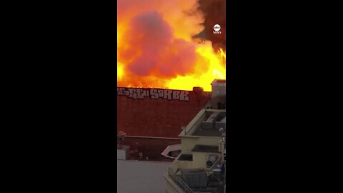 INFERNO: Firefighters are battling a huge blaze that has engulfed a multi-story building