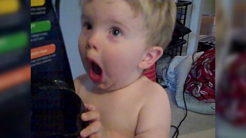 Funny Tot Boy Gets Fascinated By A Vacuum