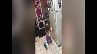 Adorable Girl Won't let Height Keep her from Magnets!
