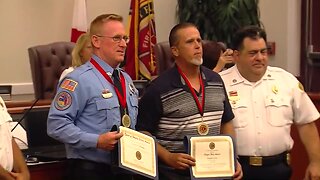 Courageous civilian, firefighter honored for rescuing woman from burning truck