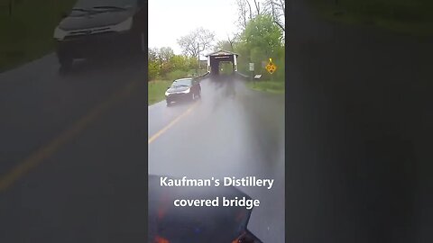 An inattentive driver pulls out in front of me, and I cross a covered bridge