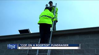 Cops on rooftop brave rain to raise money for Special Olympics