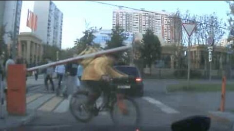 Cyclist meets automatic barrier head on