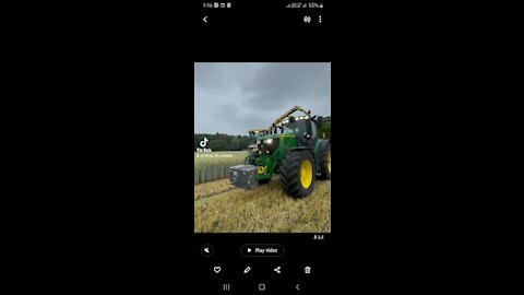 Harvesting of crop by farmaer drive John deere