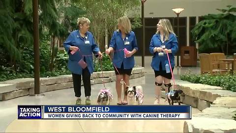 Three generations of women help at Henry Ford West Bloomfield Hospital with therapy dogs and love
