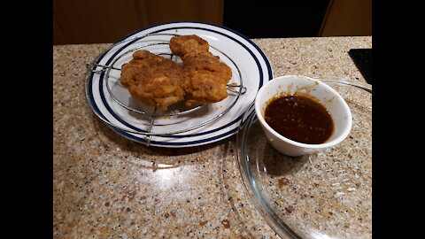 Cooking w/Sherrie Butterflied Chicken filets w/ spicy honey sauce on a bed of cabbage