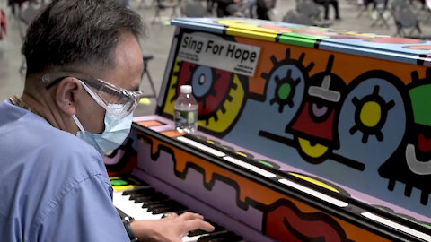Registered Nurse Jose Planillo plays the Piano at Javits Center Vaccine Site NY