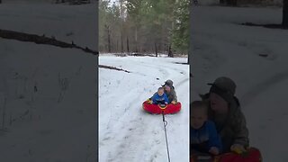 Scheels RUSH snow tube being pulled by atv on the farm.