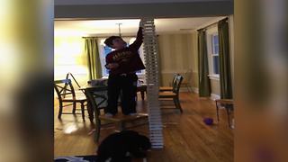 A Young Boy Makes A Ceiling-High Wooden Bar Structure