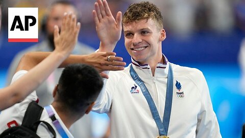 French fan zone explodes in cheers as Leon Marchand clinches second Olympic gold | NE