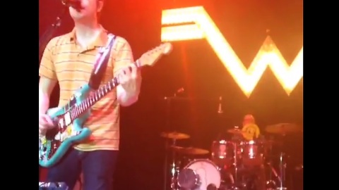 Weezer's drummer catches a frisbee mid-song