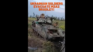 Ukrainians evacuate an M2A2 Bradley