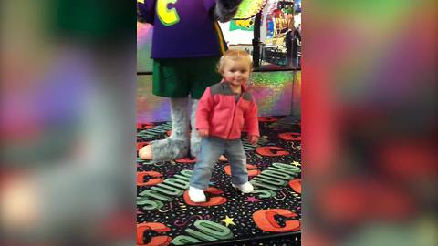 A Tot Kids Gets Knocked Down By Chuck E. Cheese Mouse Mascot