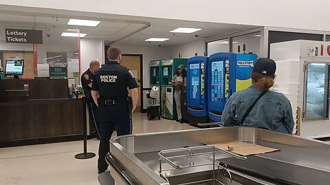 Boston police escort young lady off of Stop & Shop property at South Bay