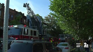 Two-alarm fire damages three row homes in Baltimore City