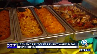 Hurricane Dorian evacuees from the Bahamas enjoy a hot meal in Boynton Beach