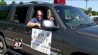 Flint airport officer stabbed in attack joins July 4 parade