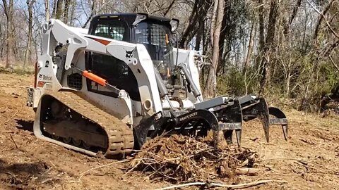 EP #17 Establishing VRBO cabin project. The clearing is DONE! Bobcat t650 grapple work and grading