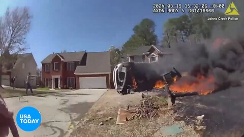 Video shows Johns Creek officers pull woman from fiery car crash