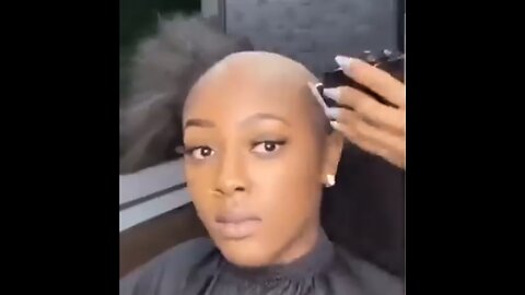 Black woman cuts off all of her natural hair so that she can glue on a wig so that it looks natural