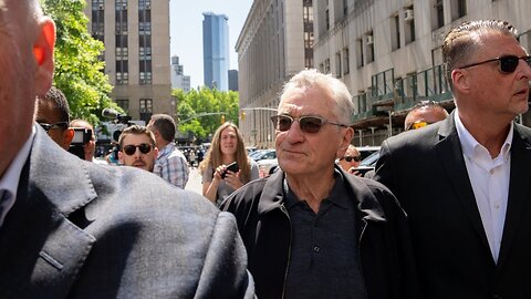 Robert De Niro clashes with a bystander during his remarks outside Trump's trial.