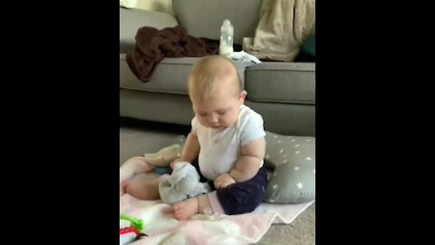 baby can't decide if he wants to sleep or sit down
